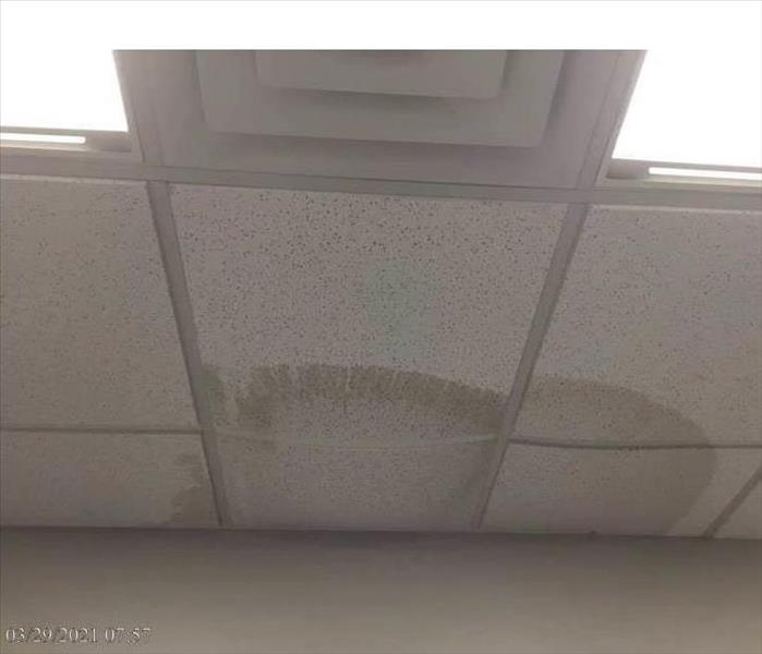 Ceiling dropping down with a huge water leak spot