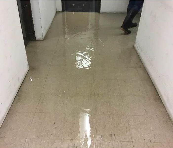 Standing water In the hallway of an office building
