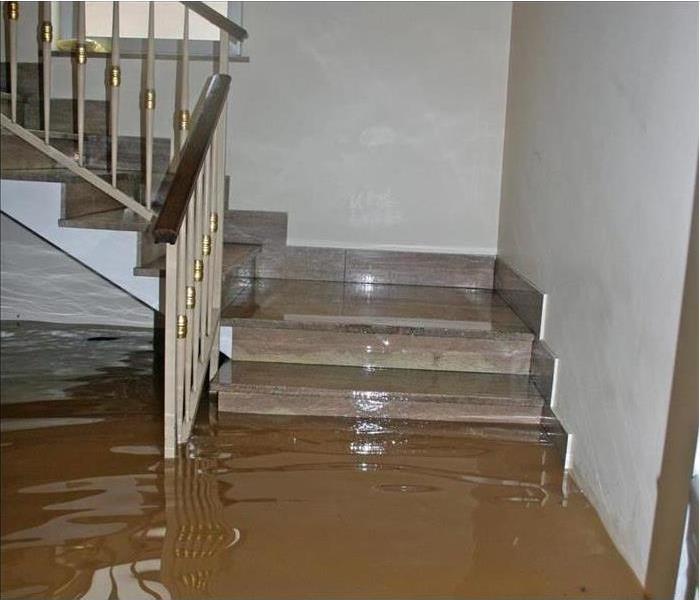 flood waters overtake house
