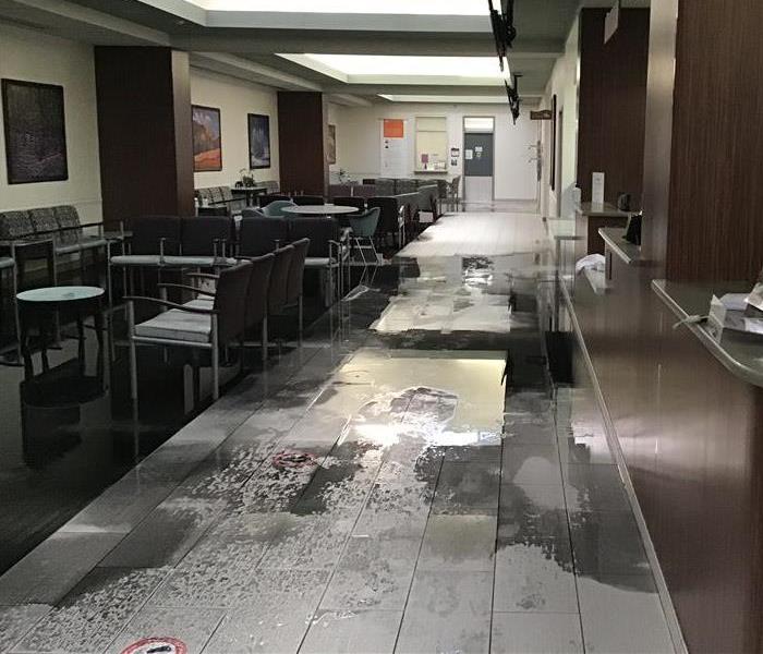 Storm water damaged commercial building flooring and cabinets