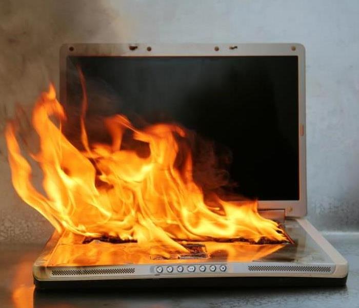 Flames around a computer.